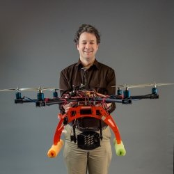 Researcher holding a drone.