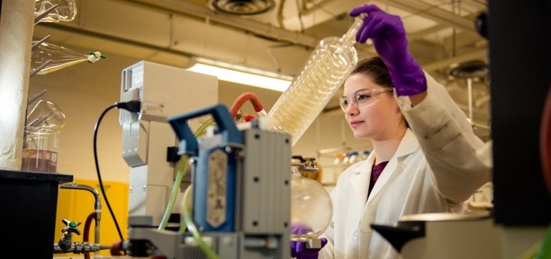 Person running tests in laboratory.