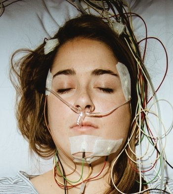 Participant's head with nasal cannula and EMG wires.