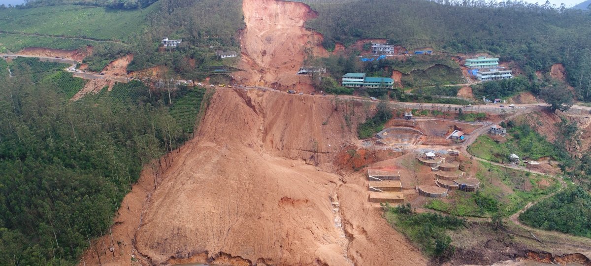 Mudslide on a cliff near buildings.