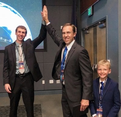 Two people high-fiving each other.