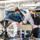 Students assembling a moon rover.