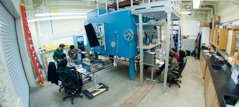 Two teams of researchers working outside the cloud chamber.