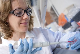Minerick Adrienne Minerick loads a blood solution into an electronic microdevice that can determine blood type. Mariusz Nowak Photo