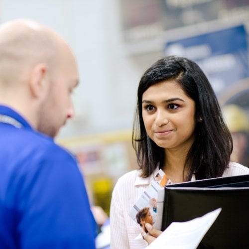 Student talking with industry at the Career Fair