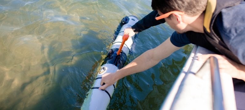 Students releasing underwater submersible