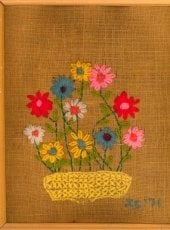 Ms. Alcott Project showing an embroidered basket of flowers