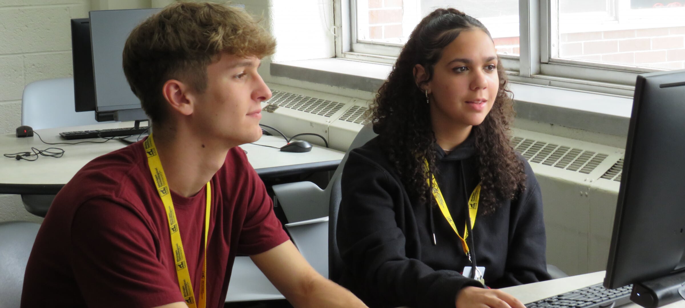 Two people using a computer