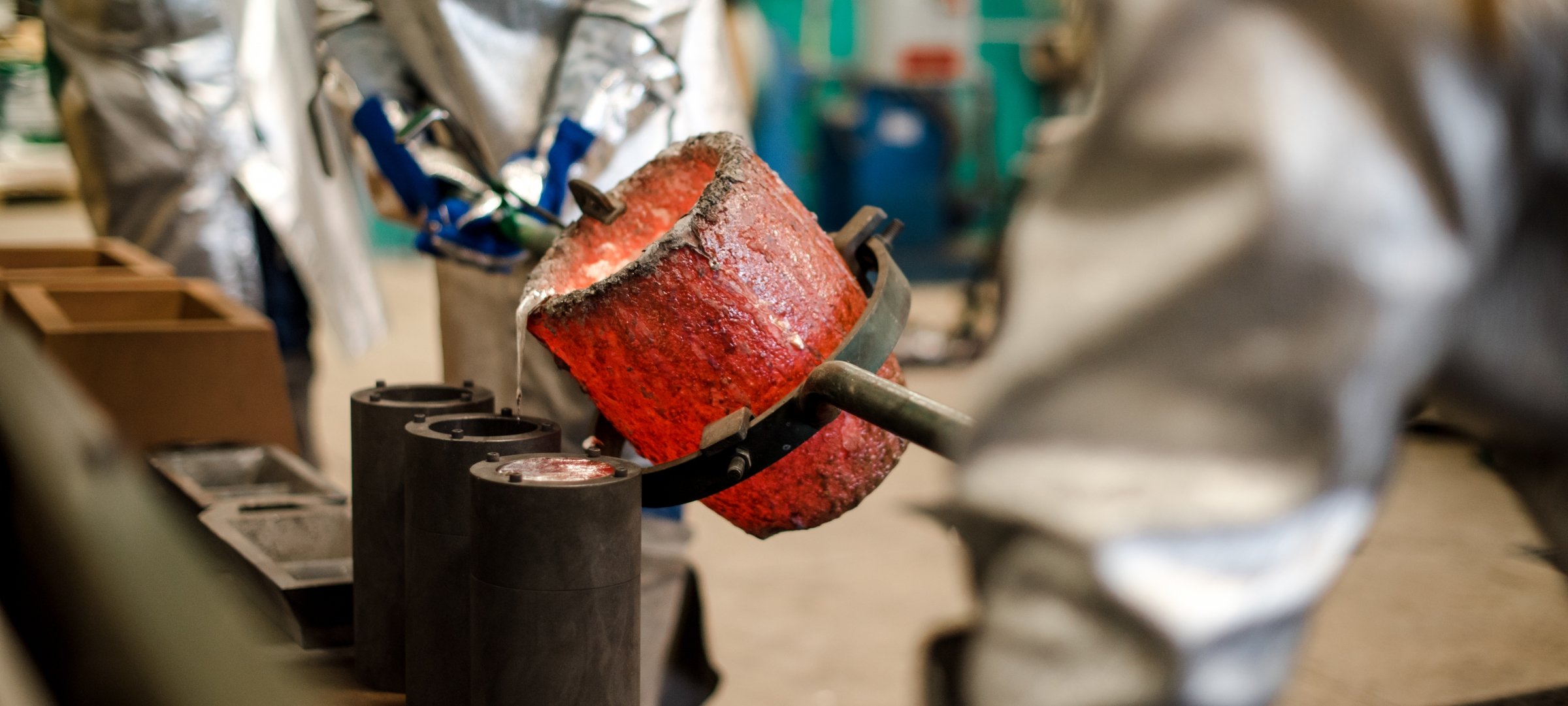 Molten metal being poured into a mold.