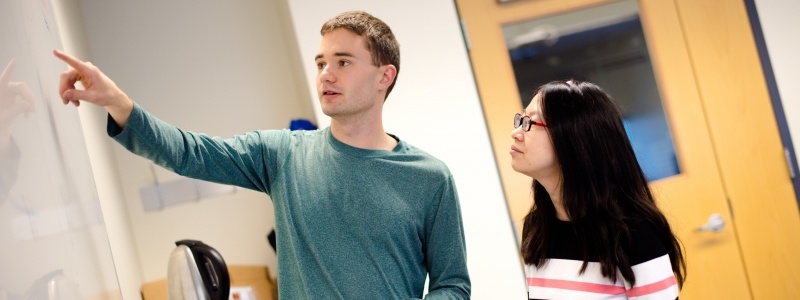 Two Math graduate students interacting