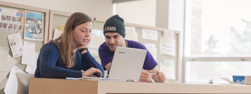 Coach helping a student in the Math Learning Center.