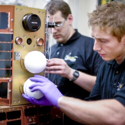 Two students build an Oculus satellite