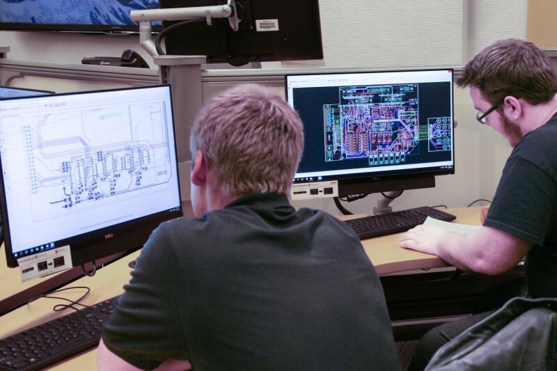 Two students working at computers