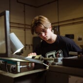 A student studying something on a table
