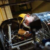 A student working on a car