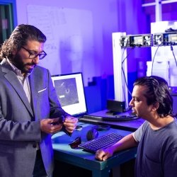 Hassan Masoud and a student in the lab.