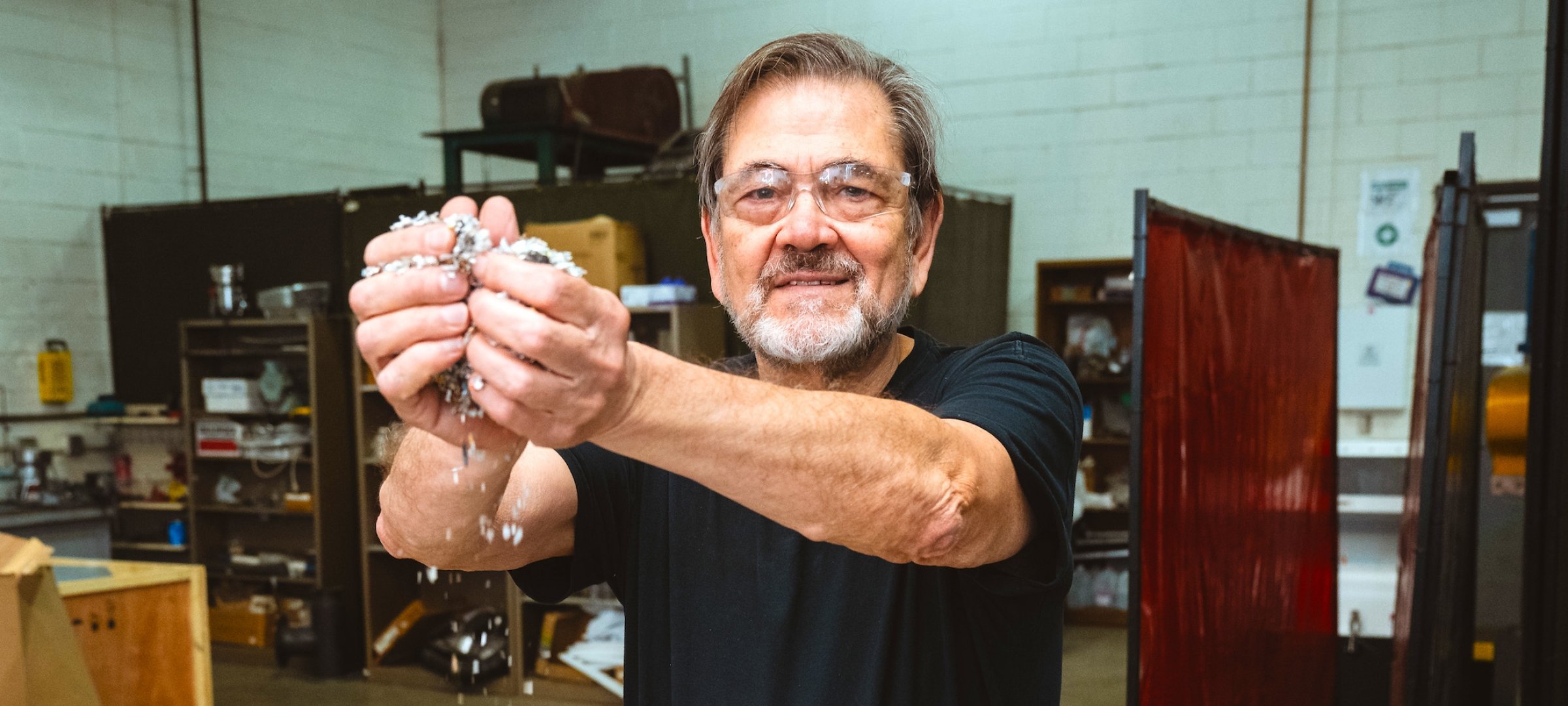 Ezra Bar-Ziv handling plastic fragments related to the STRAP process.