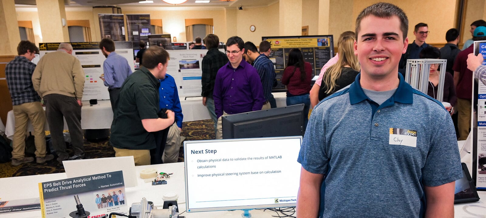 Senior Design Poster with Student and Design Expo Participants