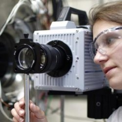 Student looking at a piece of equipment.