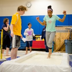 Student running across ooblek.