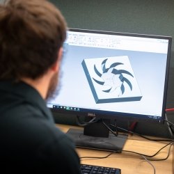 Student designing on a computer.