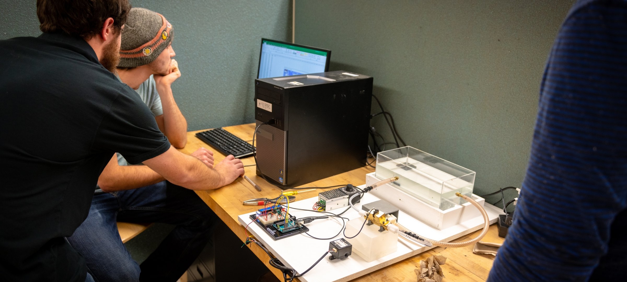 Students working on a project at a computer.