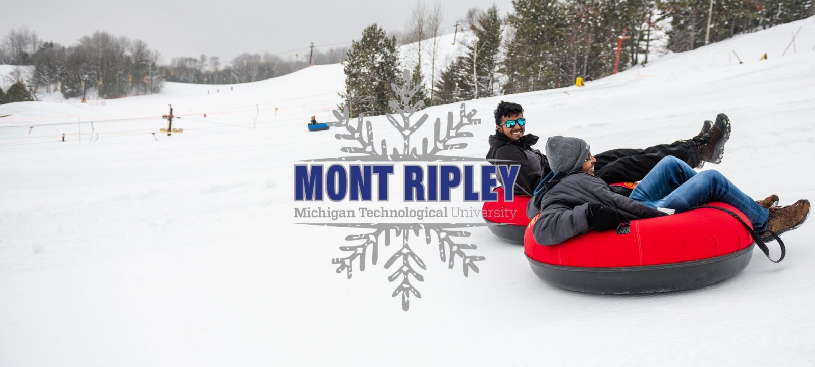 Patrons sliding down the tubing park lanes.