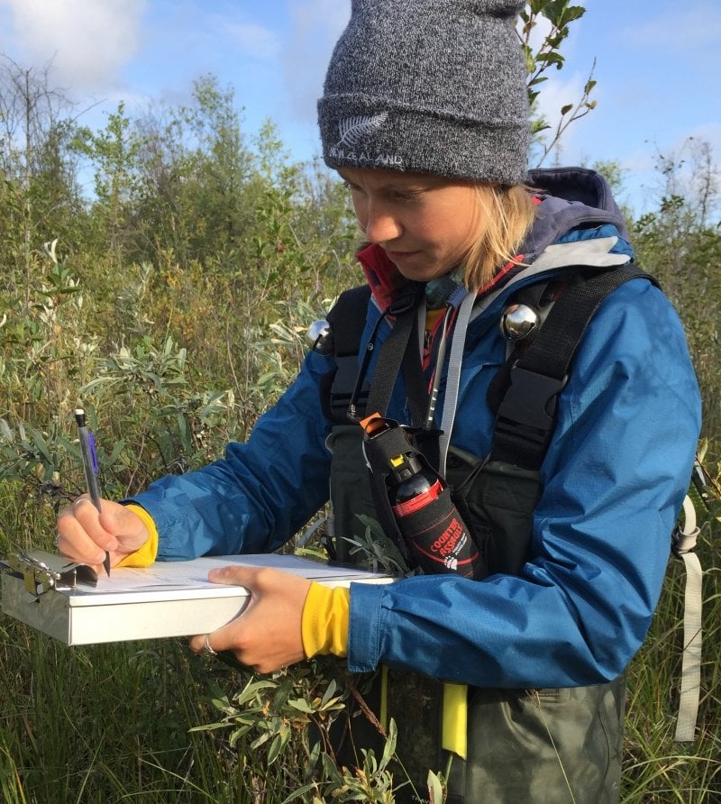 Intern making notes on a clipboard.