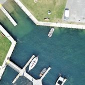 Aerial view of dock area with watermilfoil in the water.