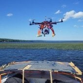 Drone flying over the prow of the boat.