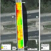 Aerial view of bridge with colored areas marking defects.