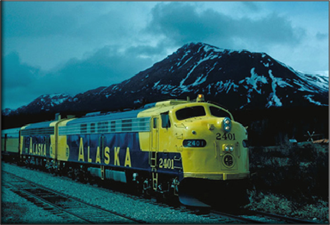 Train in front of a mountain.