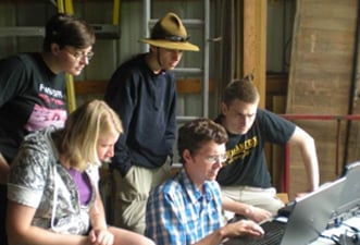 Research team looking at computers.