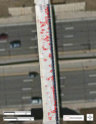 Aerial view of an overpass with small red circles on it.