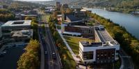Aerial view of Michigan Technological Universityâ€™s East Hall with the Portage Canal and campus buildings stretching into the distance.