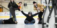 A team of four people participate in the human ice bowling event at the Student Ice Arena.