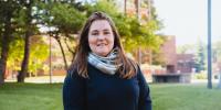 Laura Sieders standing outside on campus.