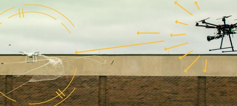 Drone catcher shooting its net at another drone.