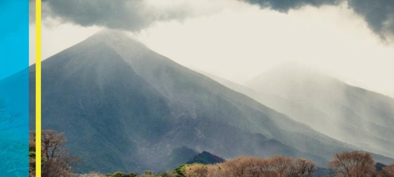 Smoke coming from the top of a volcano.