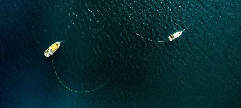 Overhead view of two boats on the water.