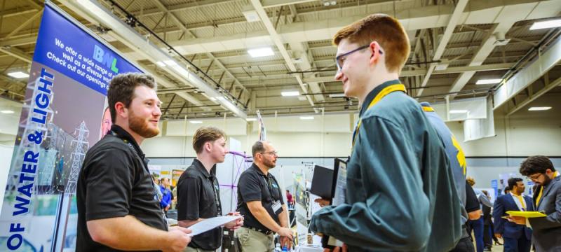 Student talking to an employer at Career Fair.