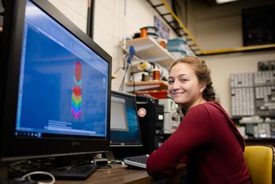 A student looking at a computer simulation.