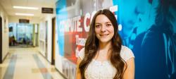 Ashley Baird standing in a hallway of the College of Computing.