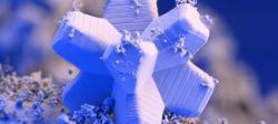 A microscopic image of a snowflake, featuring a unique geometric structure artificially colored blue, purple, and white.