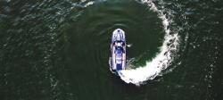 Unmanned waverunner making a circular wake in the water.