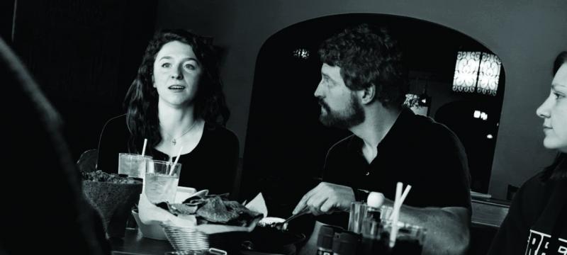Madeline Haben, Tony Schwenn and Kori Sternik around a table.