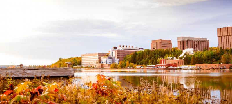 A view of campus in the fall from across the Keweenaw Waterway.