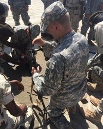 Jack Youngblood, CULP Djibouti, disassembling an AK 47 prior to qualification at a Djiboutian Armed Forces shooting range in Arta.