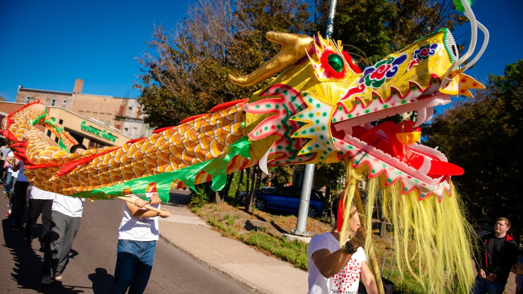 Chinese students carry a traditional dragon in the Parade of Nations.