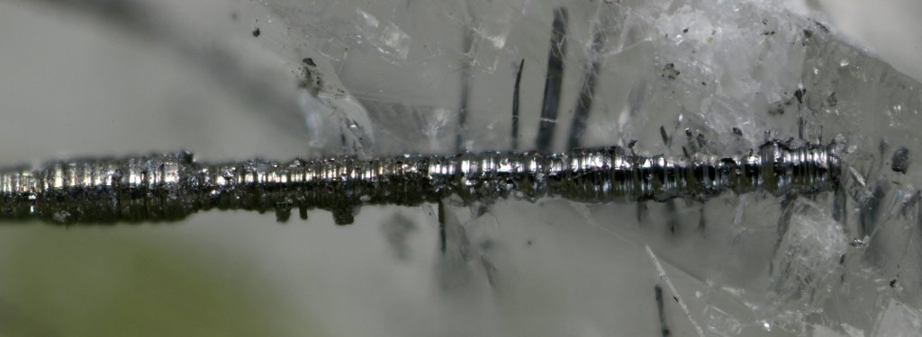 The tiny, silvery, cylindrical whiskers are a new mineral&mdash;merelaniite&mdash;named for a mining region in Tanzania.